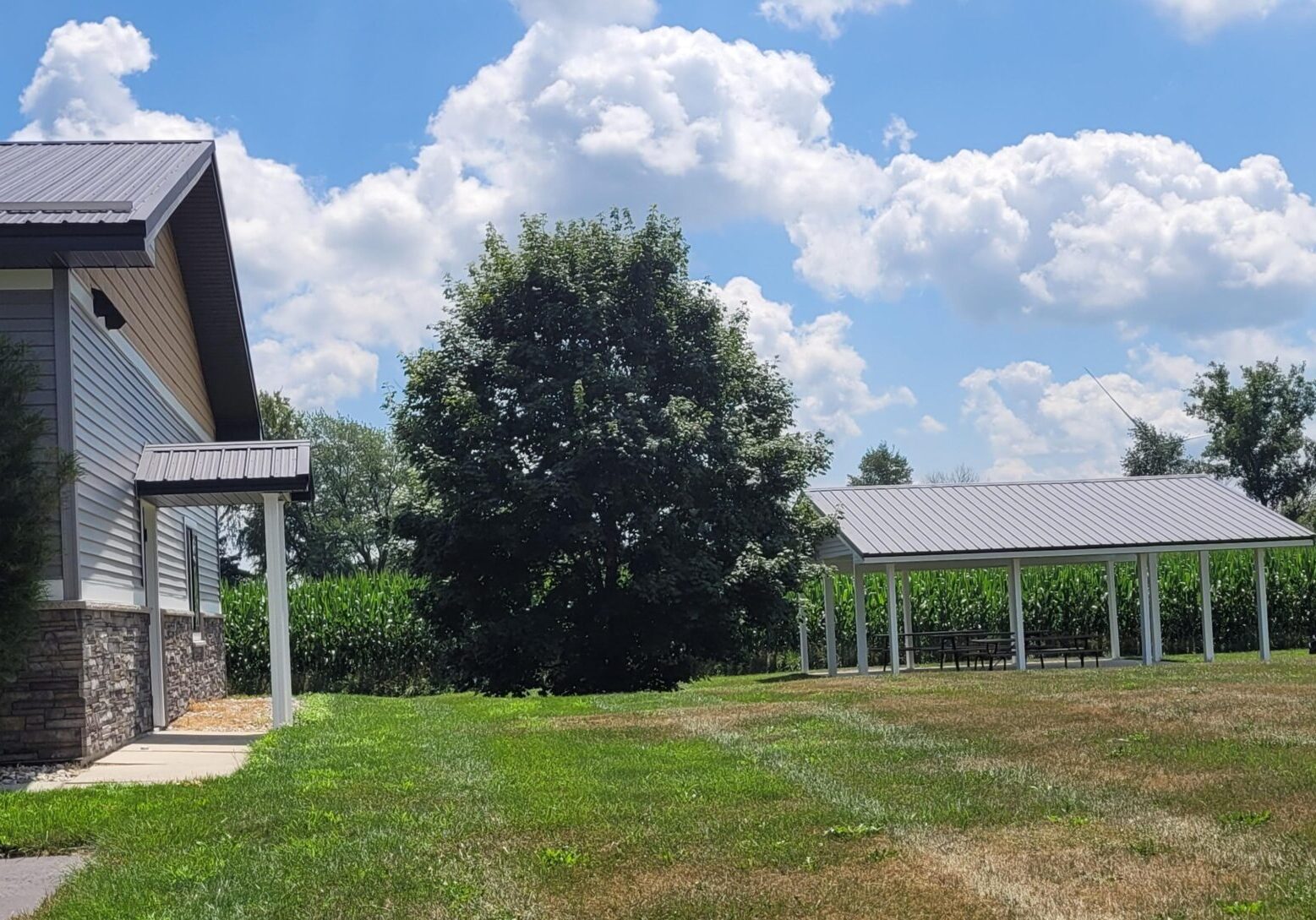 Rural landscape with pavilion and cornfield